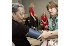 Woman ckecking blood pressure at the hospital